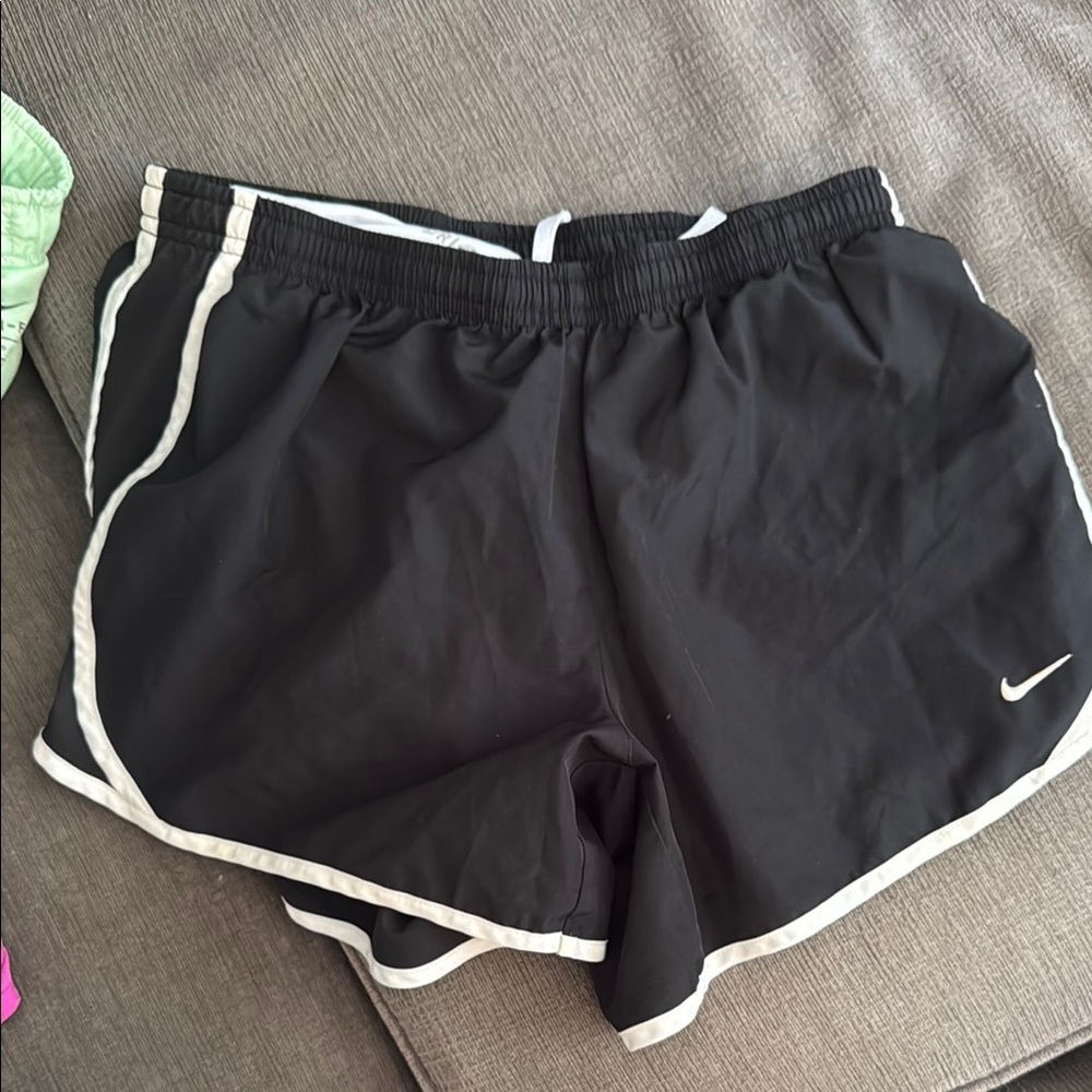 Nike Black Athletic Shorts with Curved Hem Design